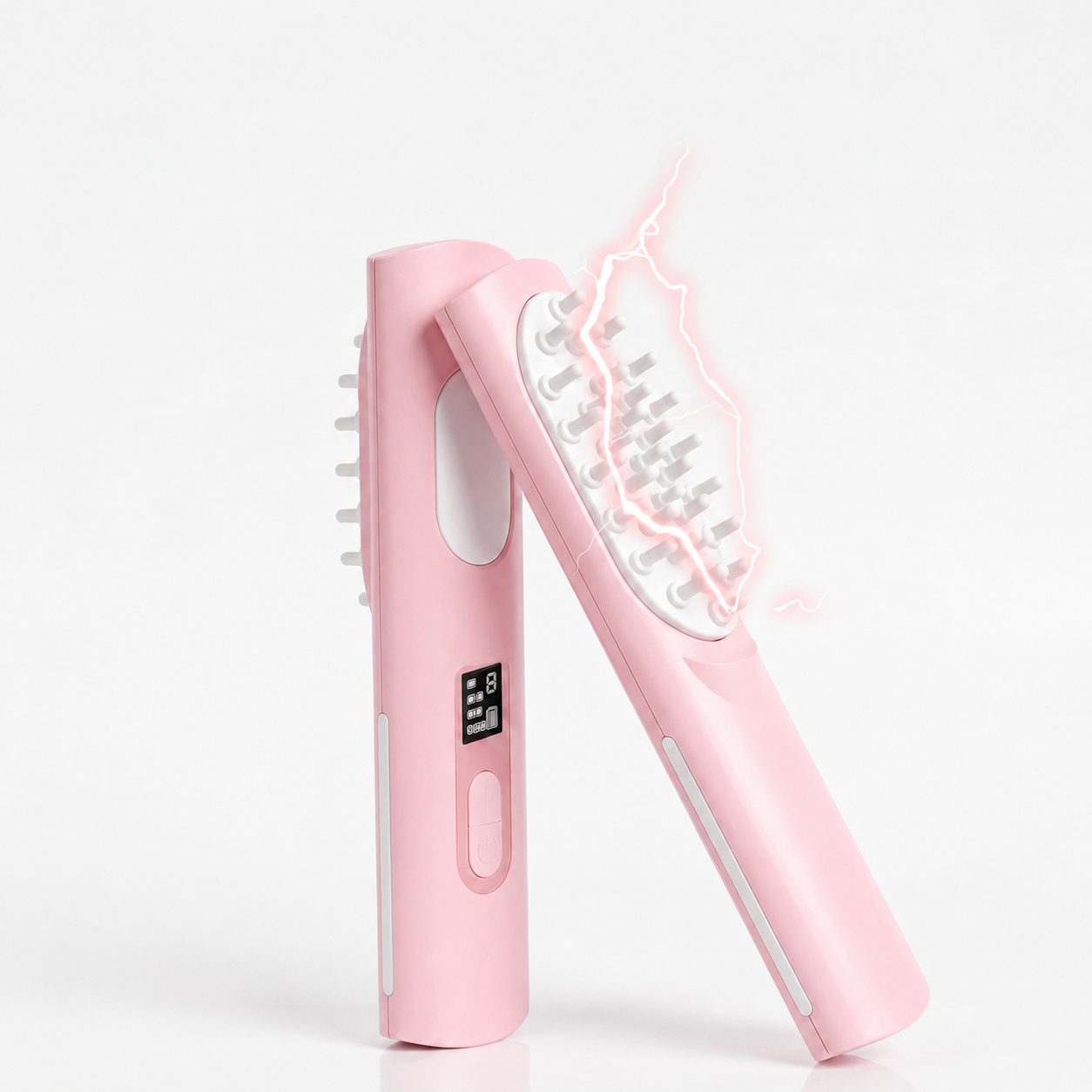 Blush pink cordless scalp massage comb with red light glow and small LED display